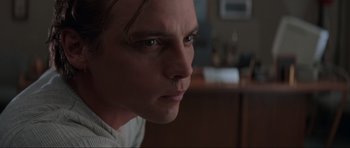 Movie still from “Scream” (1996), directed by Wes Craven – A man's face in the dark; Close Up shot, Low angle