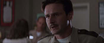 Movie still from “Scream” (1996), directed by Wes Craven – A person with a mustache; Close Up shot, Low angle