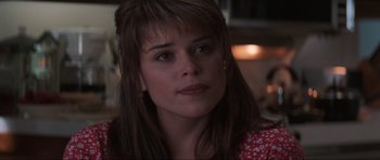 Movie still from “Scream” (1996), directed by Wes Craven – A person wearing a red shirt; Close Up shot, Over the shoulder angle