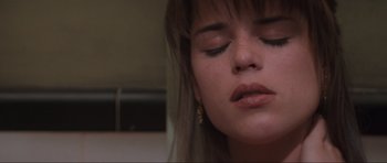 Movie still from “Scream” (1996), directed by Wes Craven – A woman's eyes and face; Close Up shot, Low angle