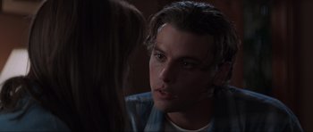 Movie still from “Scream” (1996), directed by Wes Craven – A man and a woman are looking at one another; Close Up shot, Over the shoulder angle