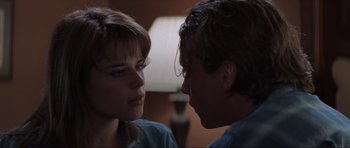 Movie still from “Scream” (1996), directed by Wes Craven – A woman and a man face to face in a room; Close Up shot, Over the shoulder angle