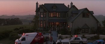 Movie still from “Scream” (1996), directed by Wes Craven – A group of people standing in front of a house; Extreme Wide shot, Low angle