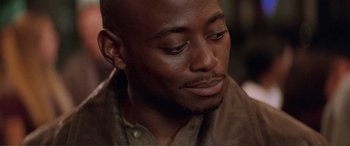 Movie still from “Scream 2” (1997), directed by Wes Craven – A person with his eyes closed; Close Up shot, Over the shoulder angle