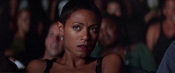Movie still from “Scream 2” (1997), directed by Wes Craven – A woman that is looking into the camera; Close Up shot, Low angle