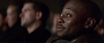 Movie still from “Scream 2” (1997), directed by Wes Craven – A person looking up at something; Close Up shot, Over the shoulder angle