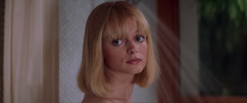 Movie still from “Scream 2” (1997), directed by Wes Craven – A person with blonde hair and blue eyes; Close Up shot, Low angle