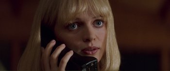 Movie still from “Scream 2” (1997), directed by Wes Craven – A person talking on a cell phone; Close Up shot, Low angle