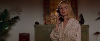 Movie still from “Scream 2” (1997), directed by Wes Craven – A woman holding a phone up to her ear; Close Up shot, Low angle