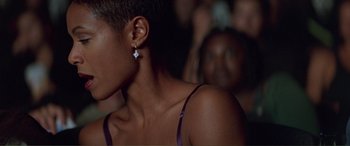Movie still from “Scream 2” (1997), directed by Wes Craven – A woman's ear with a diamond earring; Close Up shot, Over the shoulder angle