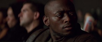 Movie still from “Scream 2” (1997), directed by Wes Craven – A person wearing a jacket; Close Up shot, Over the shoulder angle