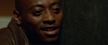 Movie still from “Scream 2” (1997), directed by Wes Craven – A man's face in the dark; Close Up shot, Low angle