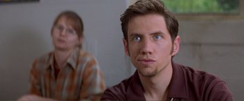 Movie still from “Scream 2” (1997), directed by Wes Craven – A person with blue eyes; Close Up shot, Over the shoulder angle