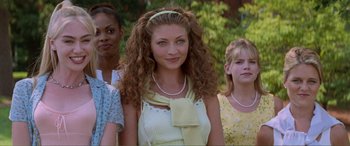 Movie still from “Scream 2” (1997), directed by Wes Craven – A group of women standing next to each other; Close Up shot, Over the shoulder angle