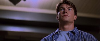 Movie still from “Scream 2” (1997), directed by Wes Craven – A man that is looking up at the sky; Close Up shot, Low angle