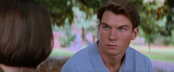 Movie still from “Scream 2” (1997), directed by Wes Craven – A man with blue eyes stares at the camera; Close Up shot, Over the shoulder angle