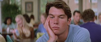 Movie still from “Scream 2” (1997), directed by Wes Craven – A person with his hand under his chin; Close Up shot, Low angle