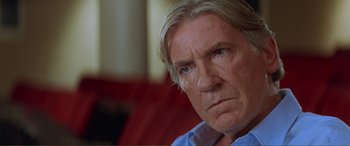 Movie still from “Scream 2” (1997), directed by Wes Craven – An older man is looking into the distance; Close Up shot, Over the shoulder angle