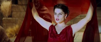 Movie still from “Scream 2” (1997), directed by Wes Craven – A woman in a red dress holding her arm up; Close Up shot, Low angle