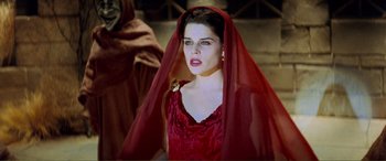 Movie still from “Scream 2” (1997), directed by Wes Craven – A woman in a red dress with a red veil; Medium shot, Over the shoulder angle