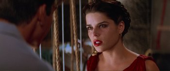 Movie still from “Scream 2” (1997), directed by Wes Craven – A person wearing a red dress; Close Up shot, Over the shoulder angle