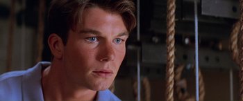 Movie still from “Scream 2” (1997), directed by Wes Craven – A man's face in a room; Close Up shot, High angle