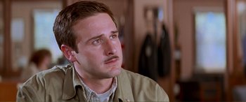 Movie still from “Scream 2” (1997), directed by Wes Craven – A person with a mustache; Close Up shot, Low angle