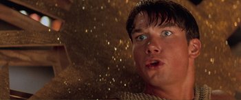 Movie still from “Scream 2” (1997), directed by Wes Craven – A young man looking surprised at the camera; Close Up shot, Low angle