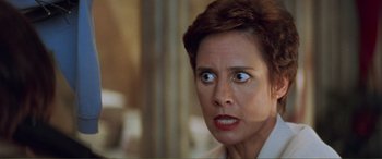 Movie still from “Scream 2” (1997), directed by Wes Craven – A person looking angry; Close Up shot, Low angle