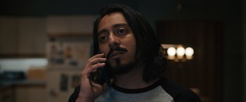 Movie still from “Scream VI” (2023), directed by Matt Bettinelli-Olpin – A person talking on a cell phone; Close Up shot, Over the shoulder angle