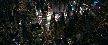 Movie still from “Scream VI” (2023), directed by Matt Bettinelli-Olpin – An aerial view of a large city at night time; Extreme Wide shot, Overhead angle