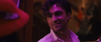 Movie still from “Scream VI” (2023), directed by Matt Bettinelli-Olpin – A person wearing a white shirt; Close Up shot, Over the shoulder angle