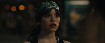 Movie still from “Scream VI” (2023), directed by Matt Bettinelli-Olpin – A person wearing a hat; Close Up shot, Over the shoulder angle