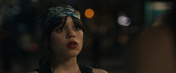 Movie still from “Scream VI” (2023), directed by Matt Bettinelli-Olpin – A person wearing a head scarf; Close Up shot, Over the shoulder angle