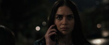 Movie still from “Scream VI” (2023), directed by Matt Bettinelli-Olpin – A person talking on a cell phone; Close Up shot, Low angle