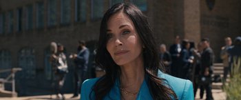 Movie still from “Scream VI” (2023), directed by Matt Bettinelli-Olpin – A person with long hair; Close Up shot, Over the shoulder angle