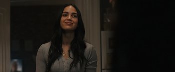 Movie still from “Scream VI” (2023), directed by Matt Bettinelli-Olpin – A beautiful young lady with long black hair; Close Up shot, Over the shoulder angle