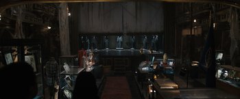 Movie still from “Scream VI” (2023), directed by Matt Bettinelli-Olpin – A room filled with lots of statues on display; Wide shot, High angle