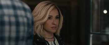 Movie still from “Scream VI” (2023), directed by Matt Bettinelli-Olpin – A person wearing a black jacket; Close Up shot, Over the shoulder angle