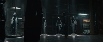 Movie still from “Scream VI” (2023), directed by Matt Bettinelli-Olpin – A group of people standing in a dark room; Wide shot, Low angle
