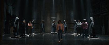 Movie still from “Scream VI” (2023), directed by Matt Bettinelli-Olpin – A group of people standing in front of a door; Wide shot, High angle