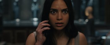 Movie still from “Scream VI” (2023), directed by Matt Bettinelli-Olpin – A young woman is on her cell phone; Close Up shot, Low angle