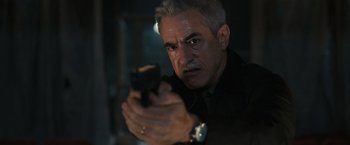 Movie still from “Scream VI” (2023), directed by Matt Bettinelli-Olpin – A person holding a gun; Close Up shot, Low angle