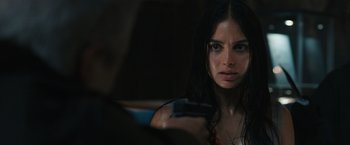 Movie still from “Scream VI” (2023), directed by Matt Bettinelli-Olpin – A beautiful young woman holding a cell phone; Close Up shot, Over the shoulder angle