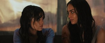 Movie still from “Scream VI” (2023), directed by Matt Bettinelli-Olpin – Two women sitting next to each other in a room; Close Up shot, Over the shoulder angle