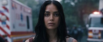 Movie still from “Scream VI” (2023), directed by Matt Bettinelli-Olpin – A person with long black hair; Close Up shot, Low angle