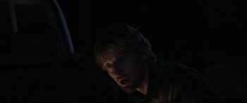 Movie still from “Secret Headquarters” (2022), directed by Henry Joost – A person in a dark room; Close Up shot, Over the shoulder angle