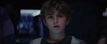 Movie still from “Secret Headquarters” (2022), directed by Henry Joost – A young boy is looking into the camera; Close Up shot, Low angle
