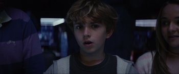 Movie still from “Secret Headquarters” (2022), directed by Henry Joost – A young boy with a surprised look on his face; Close Up shot, Low angle