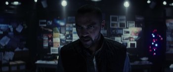 Movie still from “Secret Headquarters” (2022), directed by Henry Joost – A person in a dark room; Close Up shot, Low angle